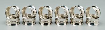 Appraisal: Set of sterling napkin rings flared ring wreath and ribbon