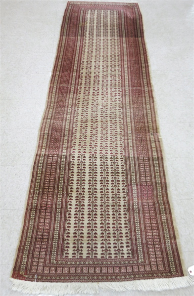 Appraisal: HAND KNOTTED BOKHARA RUNNER India or Pakistan late th century