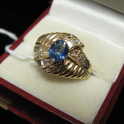 Appraisal: BLUE CEYON SAPPHIRE DIAMOND AND FOURTEEN KARAT GOLD RING WITH