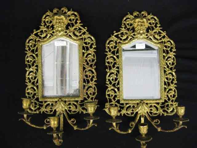 Appraisal: Pair of Bradley Hubbard Bronzed Wallmirrors with candle sconces Bacchus