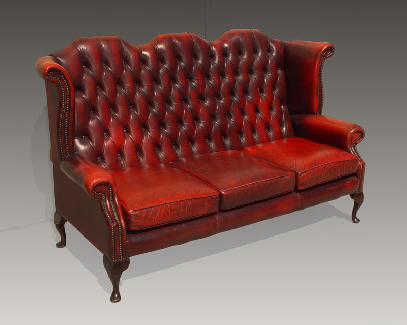 Appraisal: TUFTED RED LEATHER WINGBACK SETTEE Measures '' high x ''