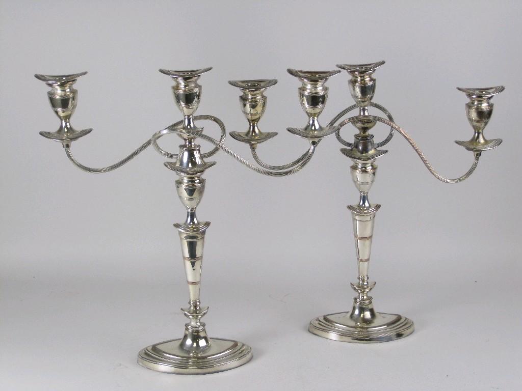 Appraisal: A pair of plated three sconce Candelabra with reeded detail