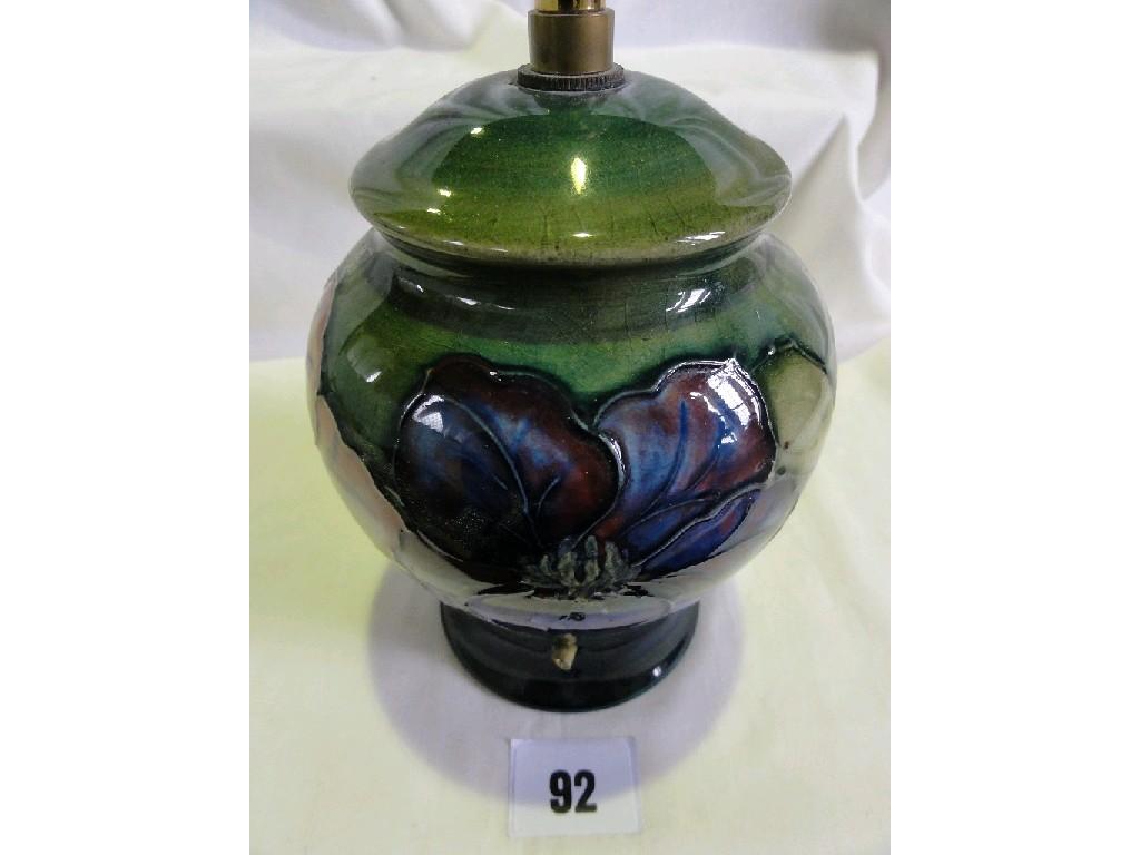 Appraisal: A Moorcroft pottery green ground lamp base with blue and