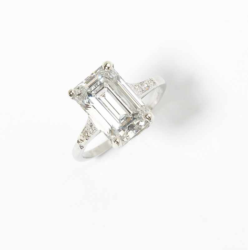 Appraisal: Mounted in platinum centering an rectangular-cut diamond weighing cts with