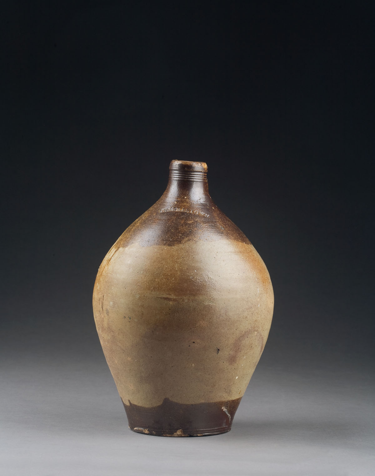 Appraisal: EARLY CHARLESTOWN STONEWARE OVOID JUG IN BROWN SLIP Height inches