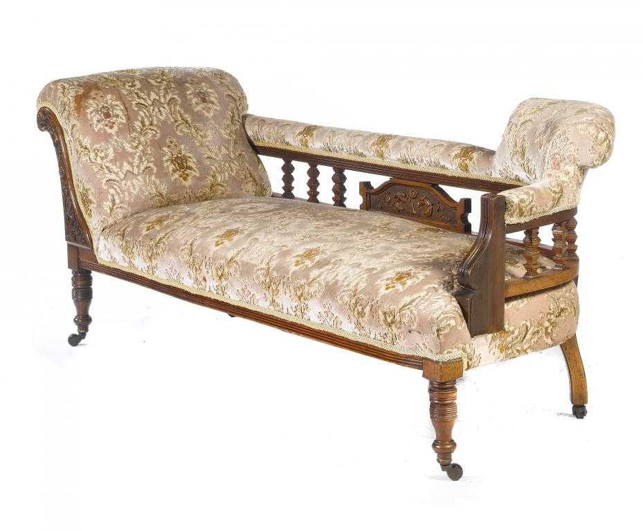 Appraisal: A VICTORIAN WALNUT CHAISE LONGUE with galleried backrail and scroll