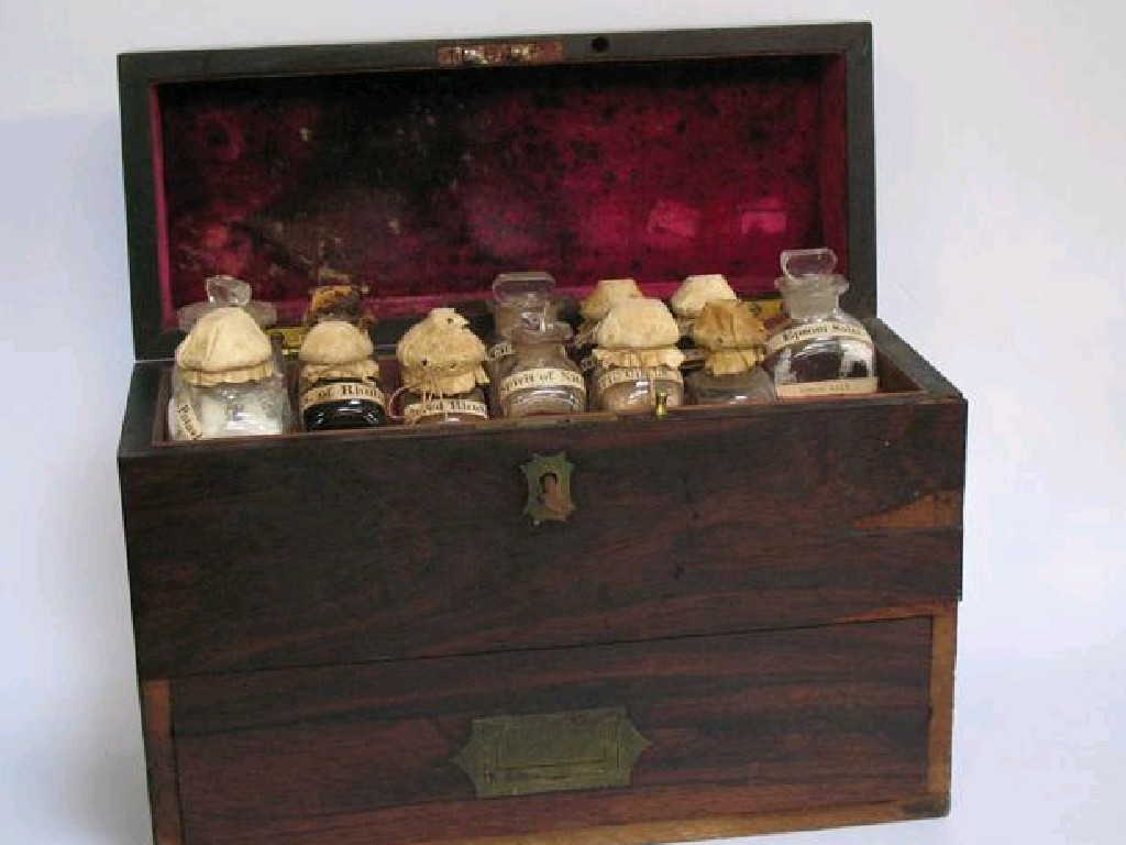 Appraisal: A REGENCY ROSEWOOD TRAVELLING APOTHECARYS CASE with brass fittings the