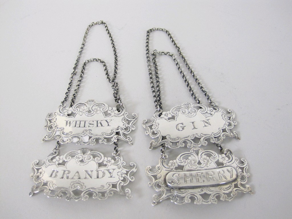 Appraisal: Pair of Victorian Bottle Tickets Gin and Brandy with pierced