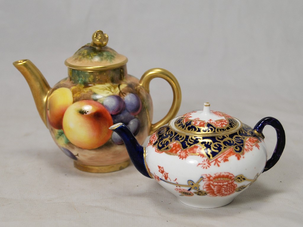 Appraisal: Royal Worcester miniature teapot painted all over with still life