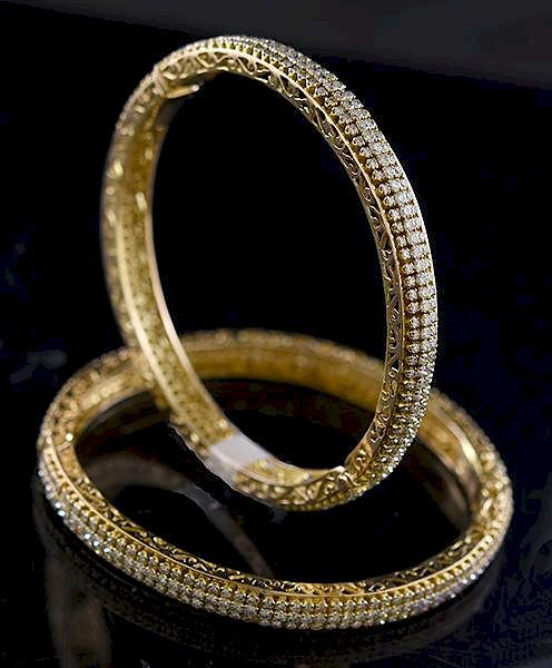 Appraisal: Matched pair of k yellow gold and diamond bracelets Matched