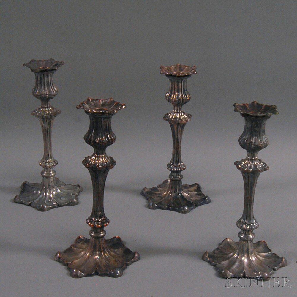 Appraisal: Set of Four English Weighted Silver-plated Candlesticks with petal-form bases