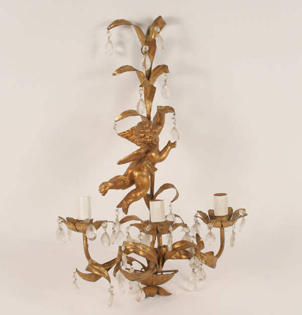 Appraisal: Gilt metal wall sconce with a cherub at the center