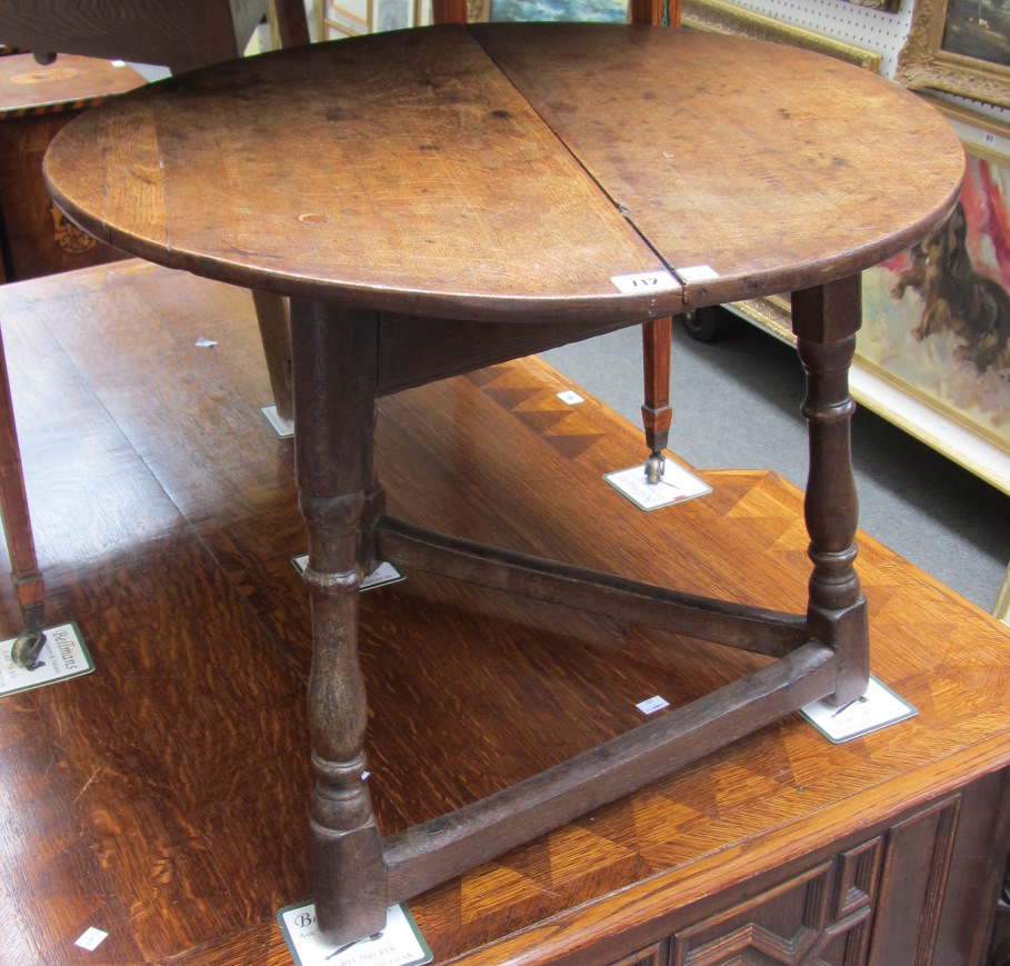 Appraisal: An th century and later oak cricket table on three