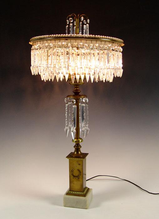 Appraisal: BRASS AND CRYSTAL TABLE TOP CHANDELIER LAMP Circular tiers of