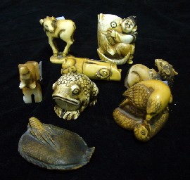 Appraisal: Eight various Japanese netsukes in carved ivory with stained finish