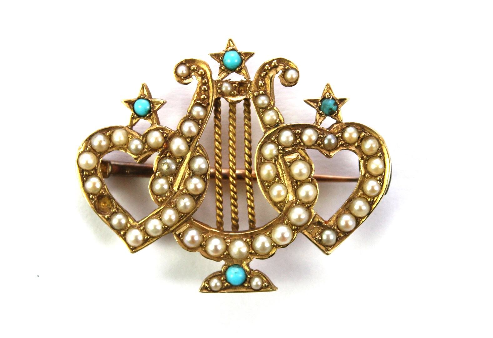 Appraisal: A gold seed pearl and turquoise set brooch designed as