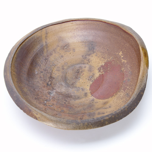 Appraisal: PAUL CHALEFF Circular charger covered in iron-oxyde brown and amber