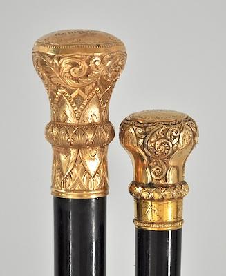 Appraisal: Two Victorian Walking Sticks with Decorative Knobs First an ebony