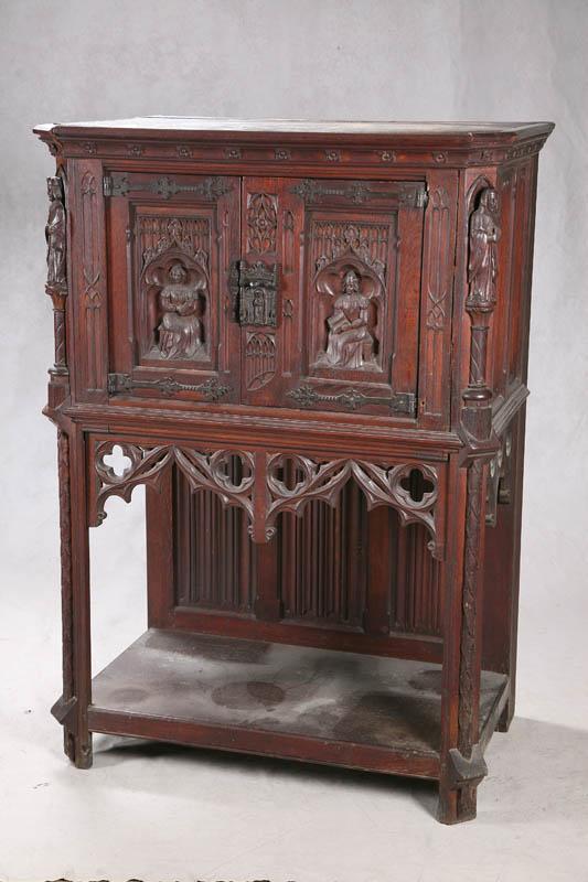 Appraisal: COURT CUPBOARD Walnut with carved figures on the chmpfered corners