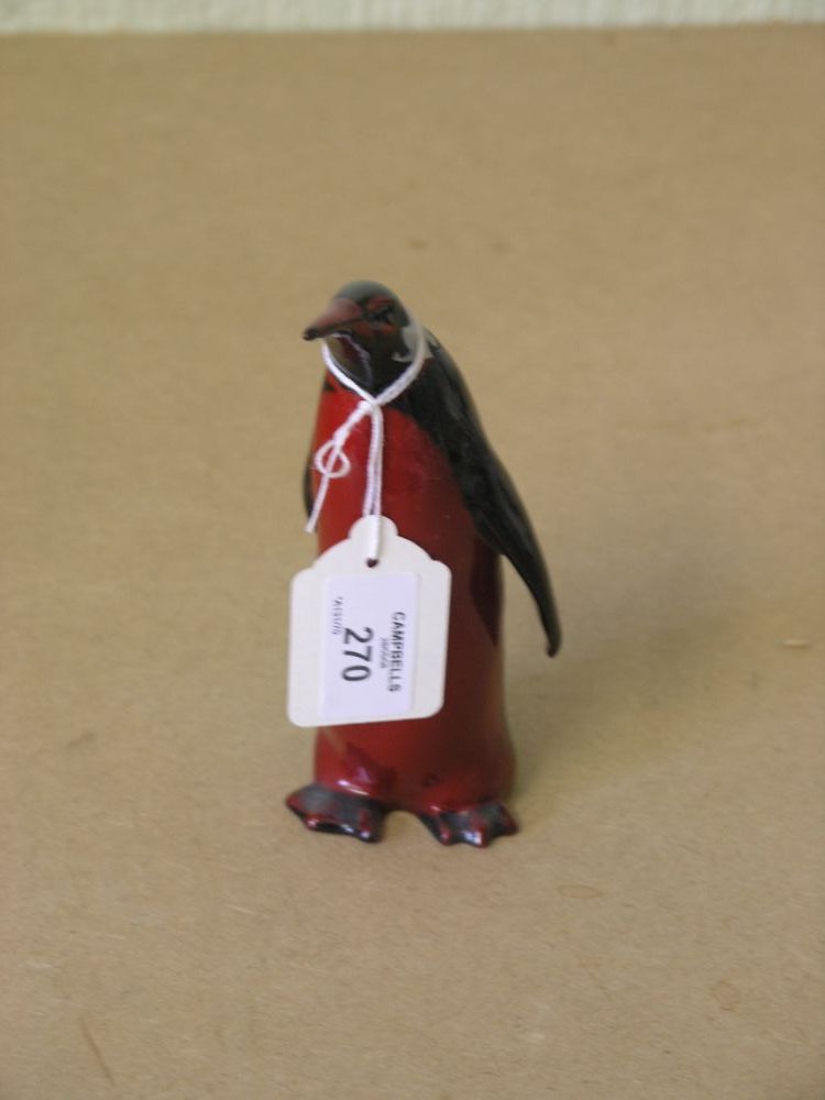 Appraisal: A Royal Doulton flambe model of a penguin standing upright