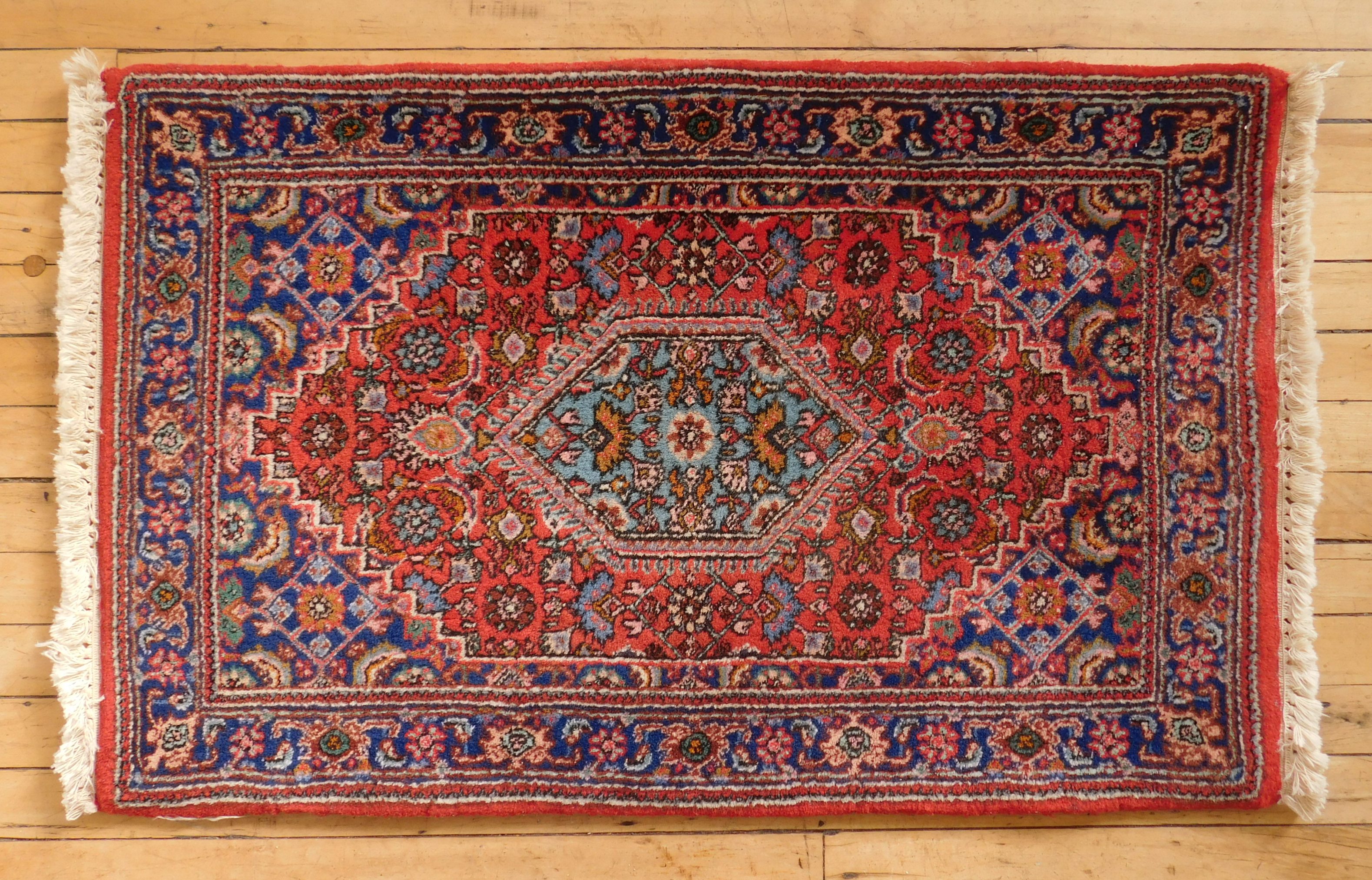 Appraisal: Oriental rug Sarouk navy blue background with red border '