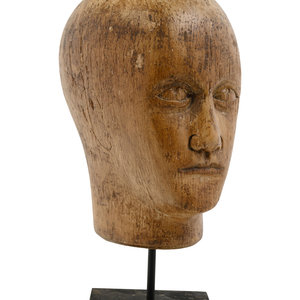 Appraisal: A Carved Wood Mannequin Head th Century raised on a