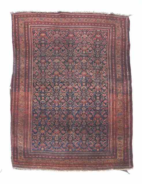 Appraisal: A SAROUK BLUE GROUND RUG with intense foliate decoration within