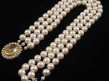 Appraisal: A three row cultured pearl necklace cm long each pearl