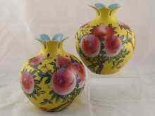 Appraisal: A pair of ceramic vases in the shape of pomegranates