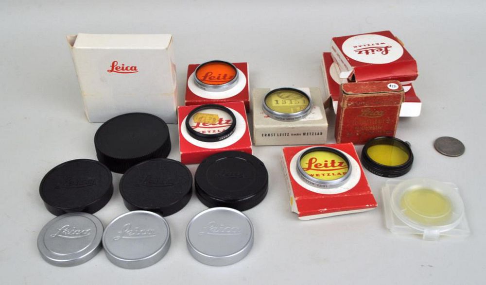 Appraisal: Group of Leica Lens Caps Accessories including three metal and