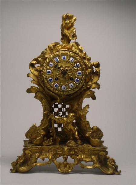 Appraisal: A late th century French rococo style gilt metal clock