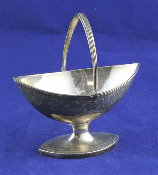 Appraisal: A George III engraved silver boat shaped sugar basket decorated