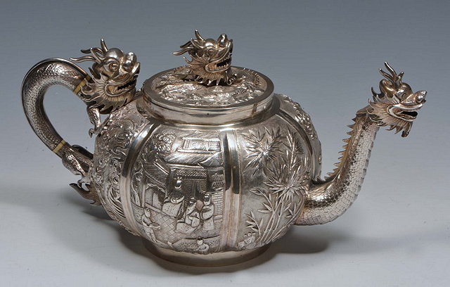 Appraisal: A CHINESE SILVER TEA POT with dragon handle spout and