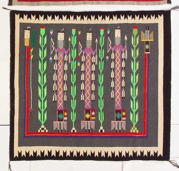 Appraisal: A Navajo Yei rug Depicting three Yei figures cornstalks and