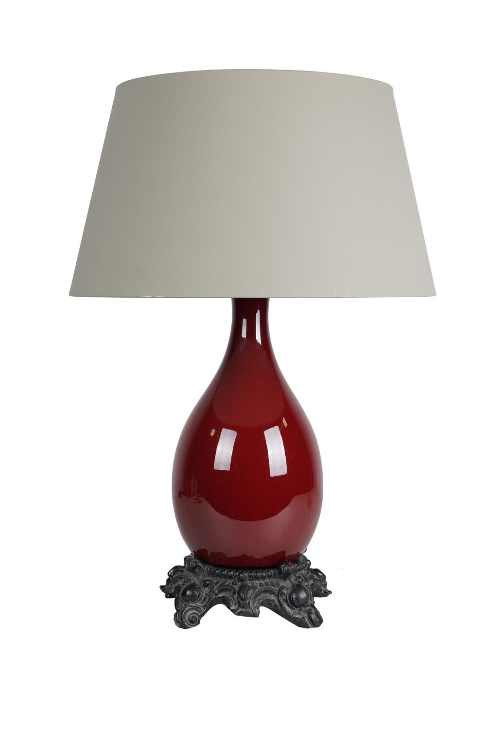 Appraisal: CHINESE STYLE RED PORCELAIN TABLE LAMPwith French style composition base