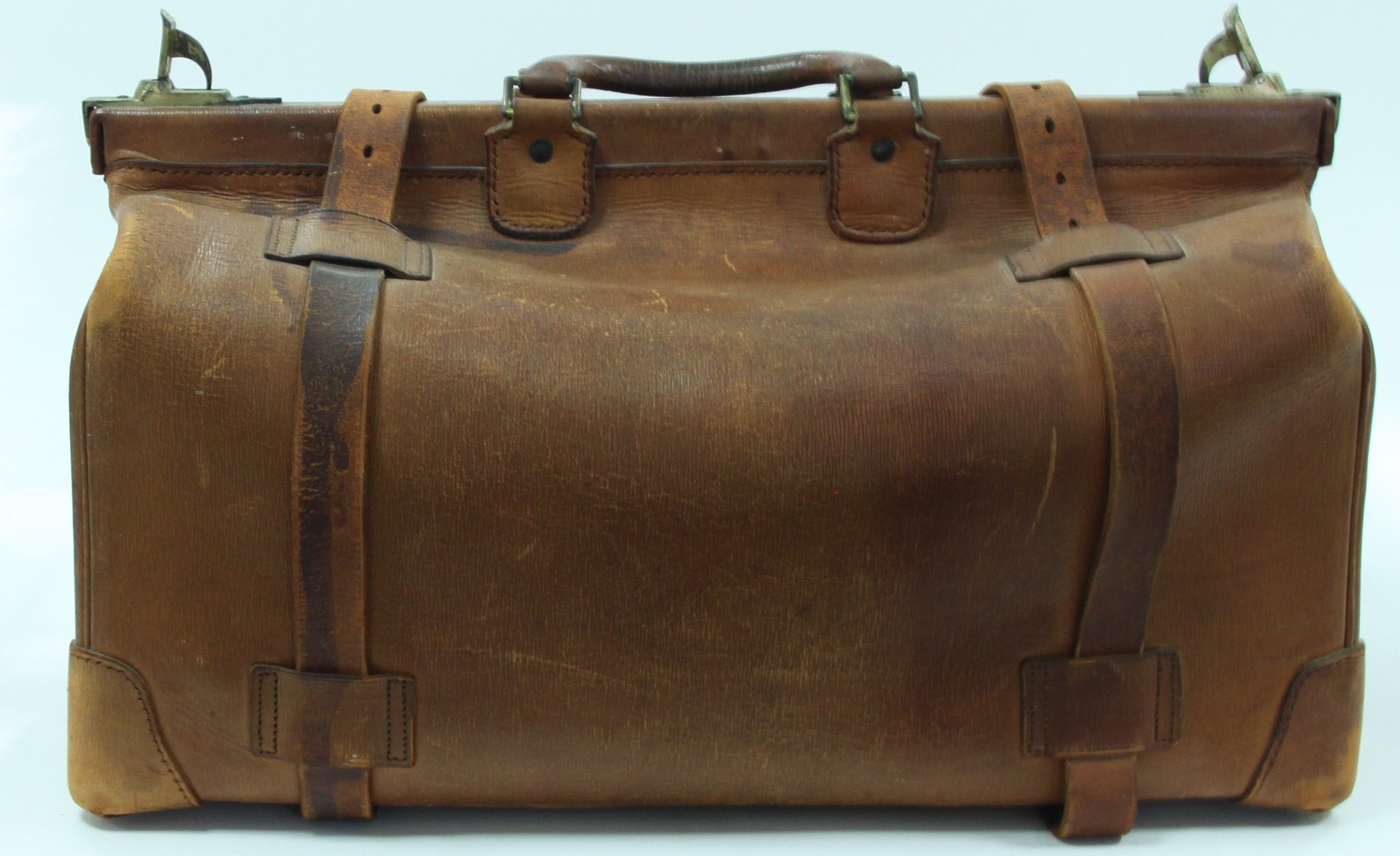 Appraisal: A Gladstone bag a copper coal scuttle a coal shovel