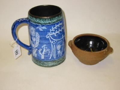 Appraisal: AN EARTHENWARE MUG 's with wax resist type decoration in