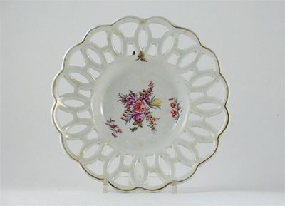 Appraisal: A Chelsea dish with reticulated border painted with flower sprays