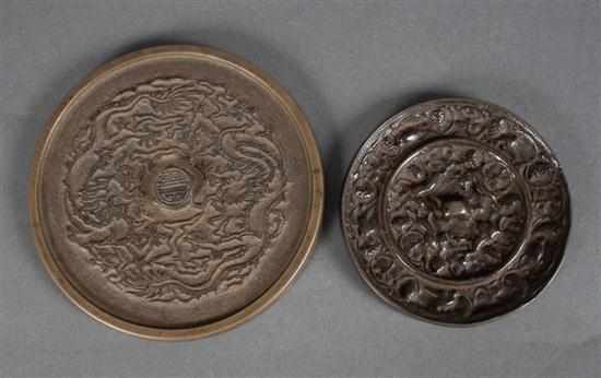 Appraisal: Two Chinese polished bronze hand mirrors in the Han manner