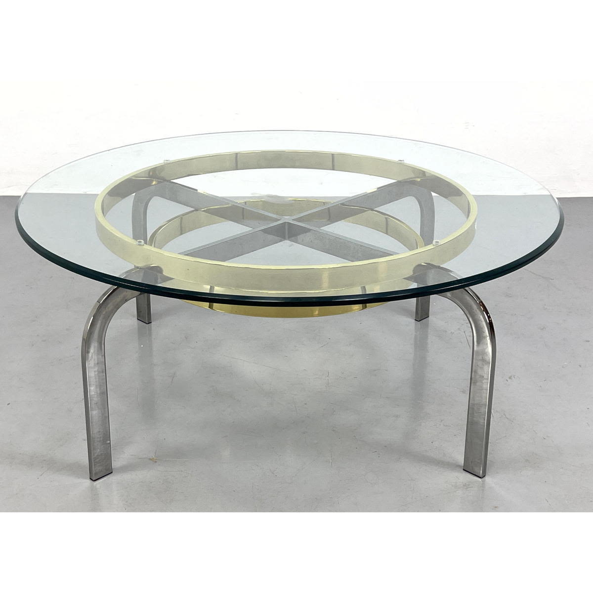 Appraisal: Glass Brass and Chrome Coffee Table Target form Base Supports