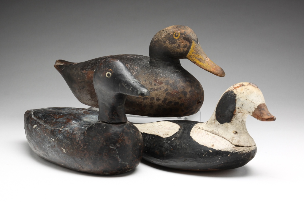 Appraisal: THREE AMERICAN DECOYS Mid th century One eider type with