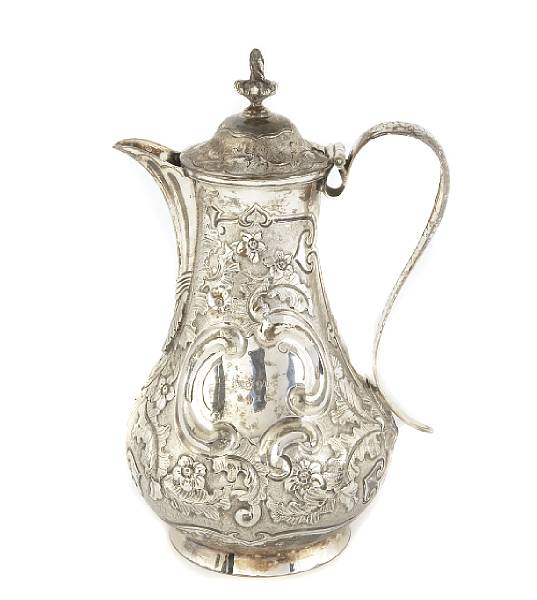 Appraisal: An Irish George I silver hot water jug later chasedGeorge