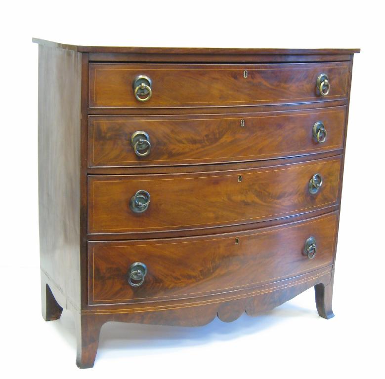 Appraisal: A late Georgian mahogany bow front Chest of four long