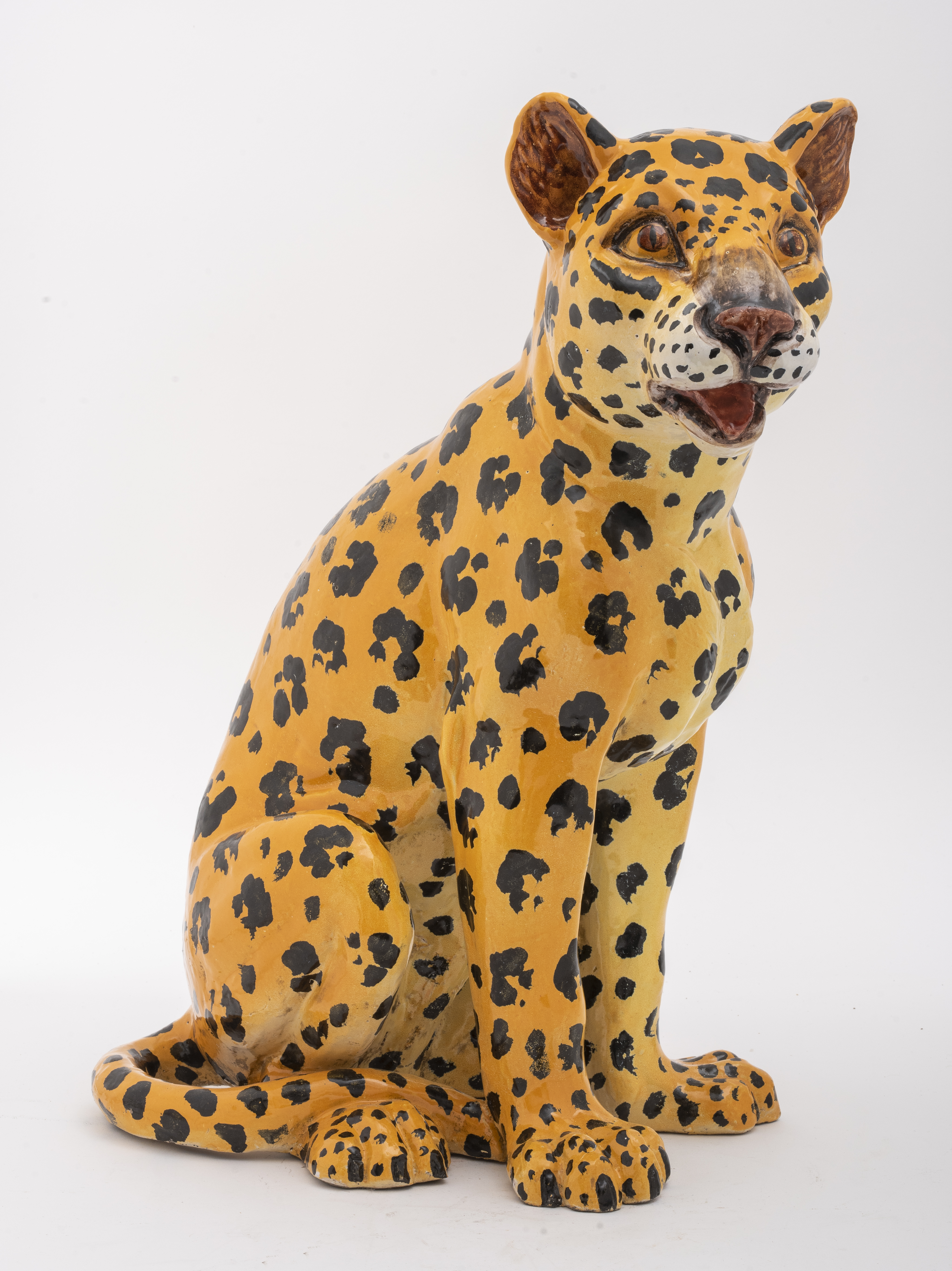 Appraisal: POLYCHROME GLAZED CERAMIC SCULPTURE OF A CHEETAH Ceramic sculpture of