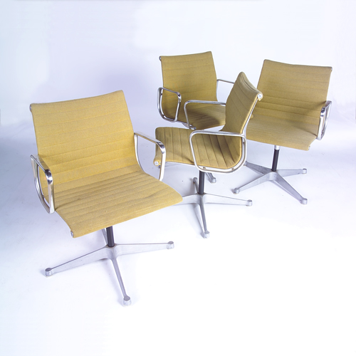 Appraisal: CHARLES EAMES HERMAN MILLER Four Aluminum Group armchairs with channeled