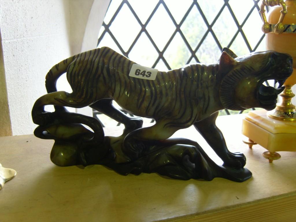 Appraisal: A carved soapstone figure of a prowling tiger -