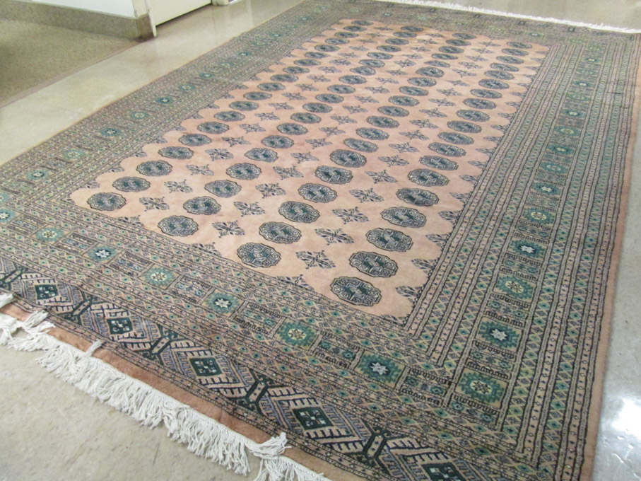 Appraisal: HAND KNOTTED ORIENTAL BOKHARA CARPET India or Pakistan repeating columns