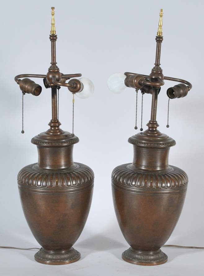 Appraisal: Pair of Bronze Urn Form Lamps possibly Handel Lamp Company