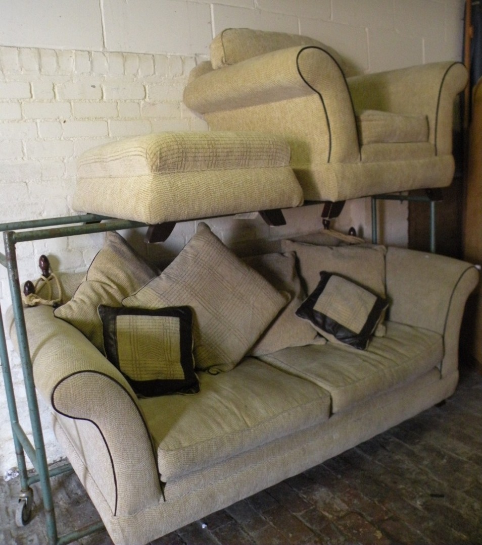 Appraisal: A three piece lounge suite comprising three seater settee armchair