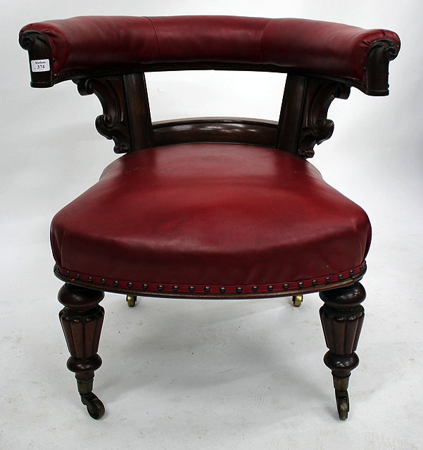 Appraisal: A WILLIAM IV MAHOGANY RED LEATHERETTE LIBRARY ARMCHAIR with carved